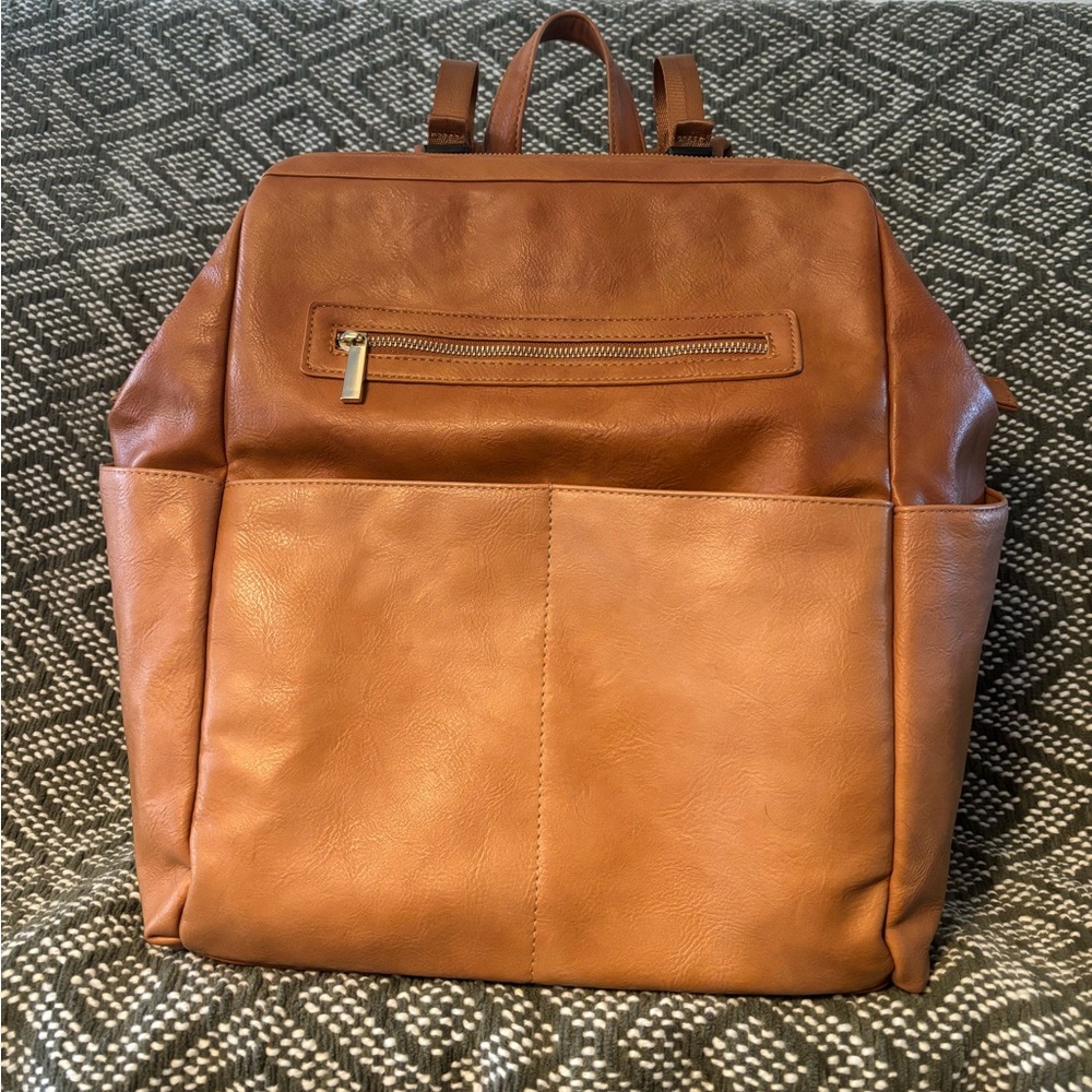 Mominside backpack diaper bag and fisher price changing pad.